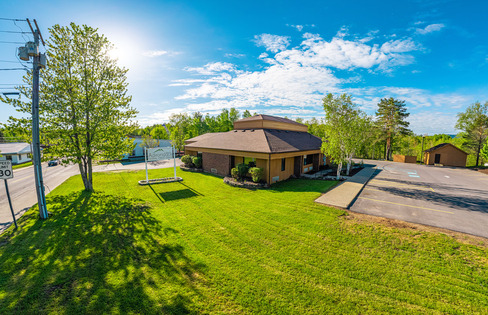 An arial view of the Tupper Lake credit union with our white business sign out front.